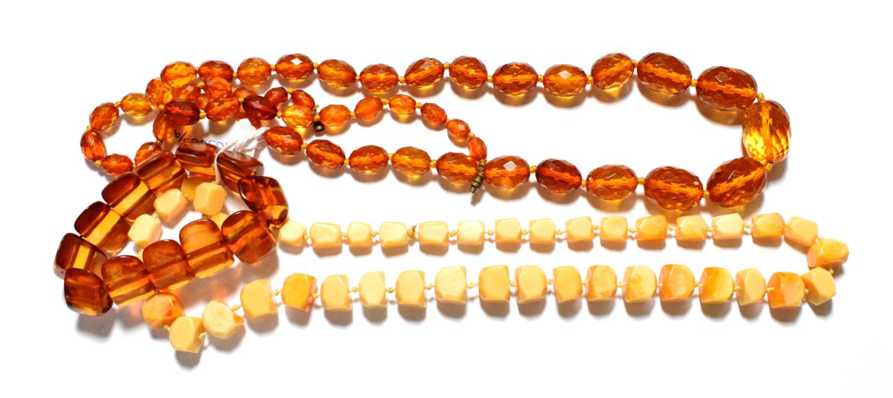 A faceted graduated amber bead necklace, length 91cm; an amber simulant bracelet; two pairs of amber