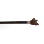 A late 19th century walking stick, with carved Black Forest knop in the form of a dog's head, silver