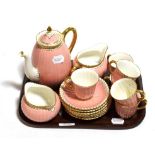 A Royal Crown Derby coffee set, pink ground, gilt embellished, six settings, damage to spout (15)