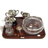 Silver rimmed bowl, white metal beaker, two trophy cups and a silver mounted decanter