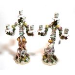 A pair of Continental floral encrusted four-light candelabra