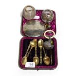 A cased set of six silver teaspoons, silver topped match strikers, Indian compact, Tiffany salt etc