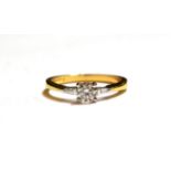 An 18 carat gold diamond solitaire ring, a round brilliant cut diamond in a white claw setting, to