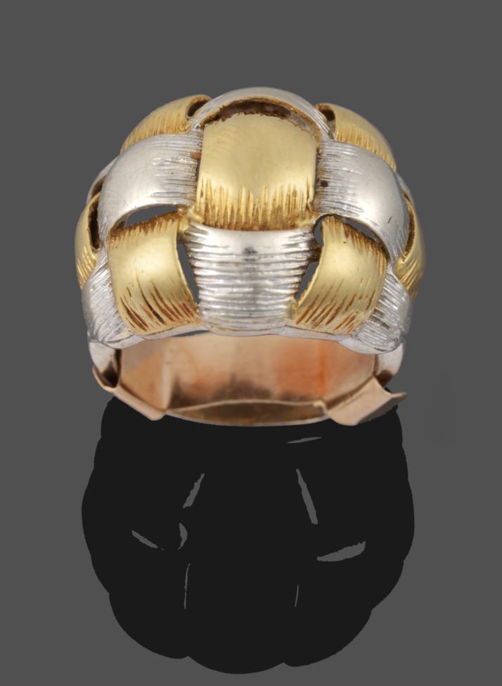 An 18 Carat Two Colour Gold Ring, of a yellow and white textured weave design, to white shoulders of