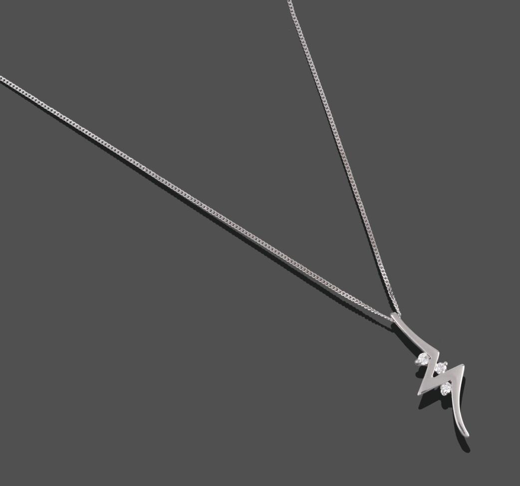 A 9 Carat White Gold Diamond Pendant on a Chain, the pendant of bolt lightening form, with three