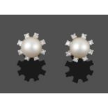 A Pair of 18 Carat White Gold Cultured Pearl and Diamond Cluster Earrings, a cultured pearl within a