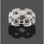 A Diamond Eternity Ring, of open brick link design, the square links with trios of round brilliant