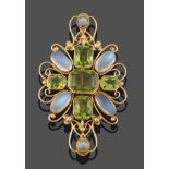 A Peridot and Moonstone Plaque Brooch, five emerald-cut peridots in a cross motif with four oval