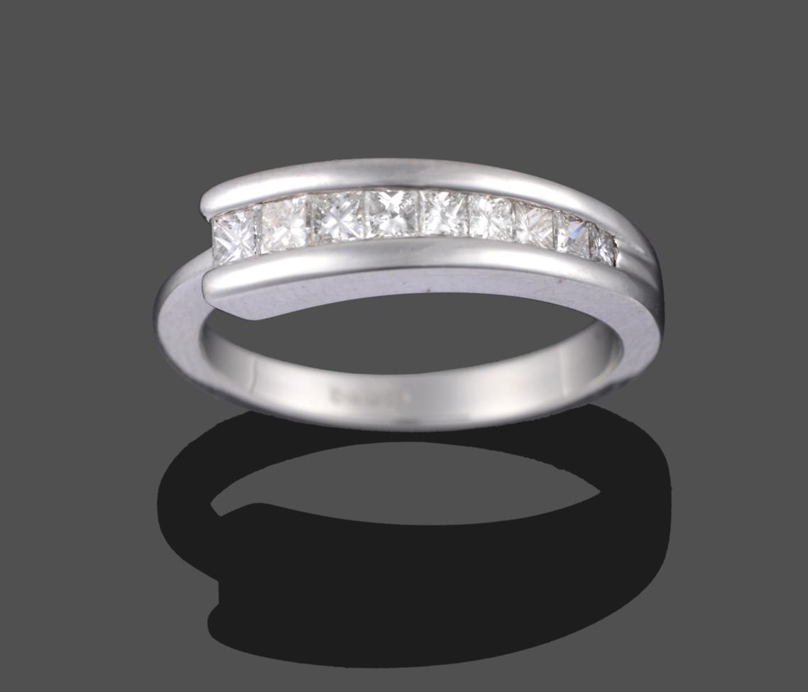 A Contemporary 18 Carat White Gold Diamond Half Hoop Ring, nine graduated princess cut diamonds in a