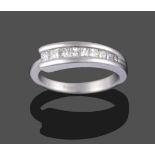 A Contemporary 18 Carat White Gold Diamond Half Hoop Ring, nine graduated princess cut diamonds in a