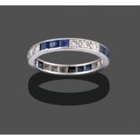 A Sapphire and Diamond Eternity Ring, trios of square step cut sapphires alternate with trios of