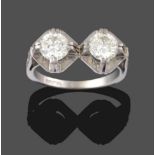 A Diamond Two Stone Ring, the round brilliant cut diamonds set side-by-side set in substantial