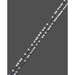 A Tanzanite and Cultured Pearl Necklace, smooth tanzanite beads spaced by cultured pearls, length