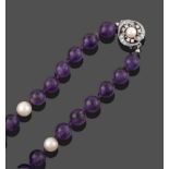 An Amethyst and Cultured Pearl Necklace, the round amethyst beads spaced by cultured pearls