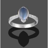 An 18 Carat White Gold Moonstone and Diamond Ring, the cabochon marquise shaped moonstone in a