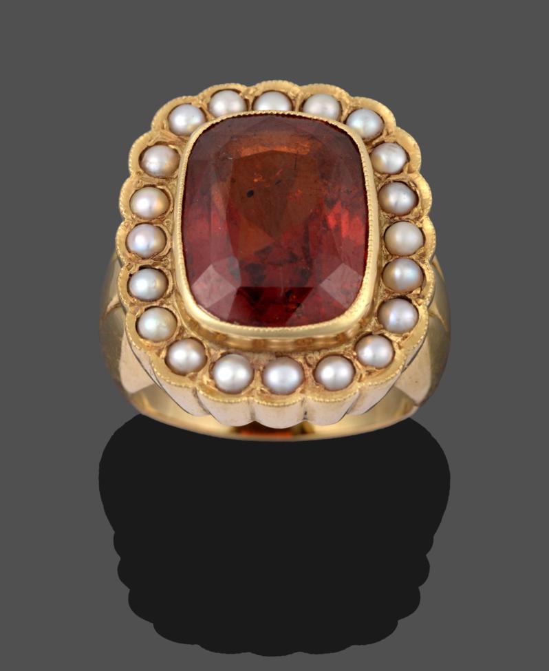 An 18 Carat Gold Hessonite Garnet and Seed Pearl Cluster Ring, the cushion cut hessonite garnet in a