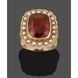 An 18 Carat Gold Hessonite Garnet and Seed Pearl Cluster Ring, the cushion cut hessonite garnet in a