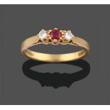 An 18 Carat Gold Ruby and Diamond Three Stone Ring, by Cropp & Farr, the central round brilliant cut