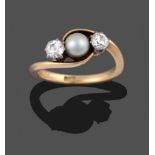 A Cultured Pearl and Diamond Three Stone Ring, the cultured pearl flanked by old cut diamonds in