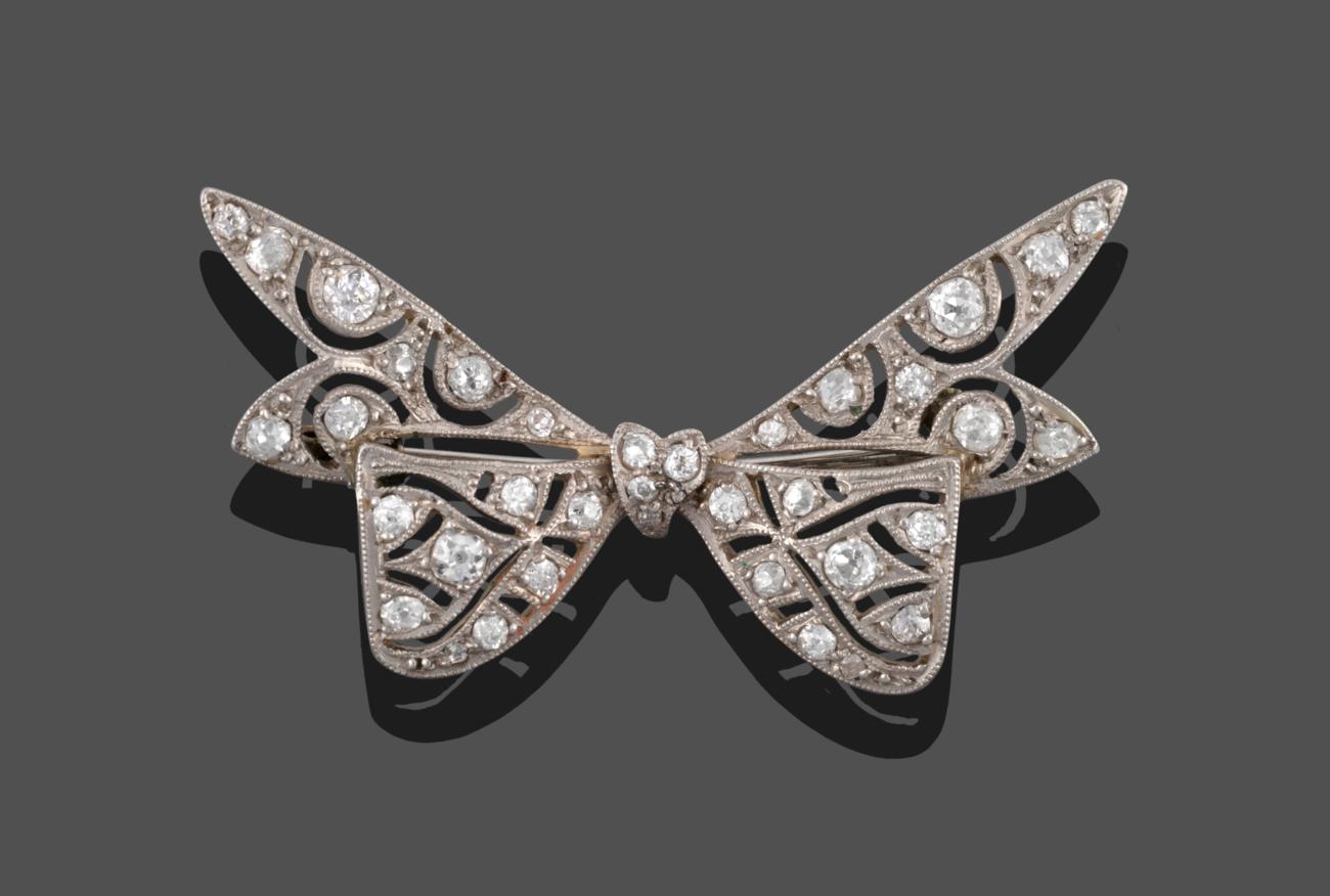 A Diamond Bow Brooch, the bow with pierced decoration and set throughout with old cut diamonds,