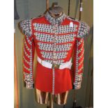 A Scarlet Wool Tunic to a Drummer of the Coldstream Guards, with fleur de lys woven braiding,