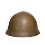 A Second World War Japanese Type 90 Naval Landing Forces Helmet, with drab olive paint, set with a