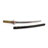 A Shinto Japanese Wakizashi, the 40.5cm steel blade with traces of billowing hamon, the unsigned