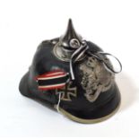 A Bavarian EM's Black Leather Pickelhaube, with white metal conical spike, rib with sliding vent,