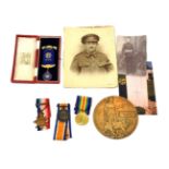 A First World War ''Mons'' Trio and Memorial Plaque, the trio comprising 1914 Star with clasp 5th