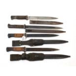 Three German Third Reich Model 1884/98 Knife Bayonets, each with waffenampt markings to the hilts,