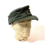 A German Third Reich Heer EM/NCO's M34 Field Cap, in green wool, the front stitched with a