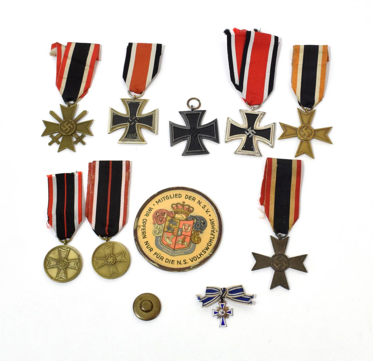 Three German Third Reich Iron Crosses, Second Class:- each of three piece construction, one with