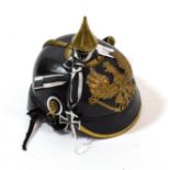 A Copy of a Prussian Leather Pickelhaube, with brass spike, rib and binding to the front brim,