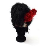 A Highland Feather Bonnet to the Black Watch, the wirework frame with black ostrich feathers over