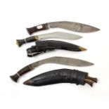 Two Nepalese Kukri, each with broad curved steel blade with double fullered back edge, steel bolster