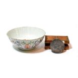 An 18th century Chinese bowl with various scenes of birds and fishing and a 10,000 yen coin