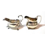 A George III silver sauceboat and a George III silver cream-jug, the first by William and James