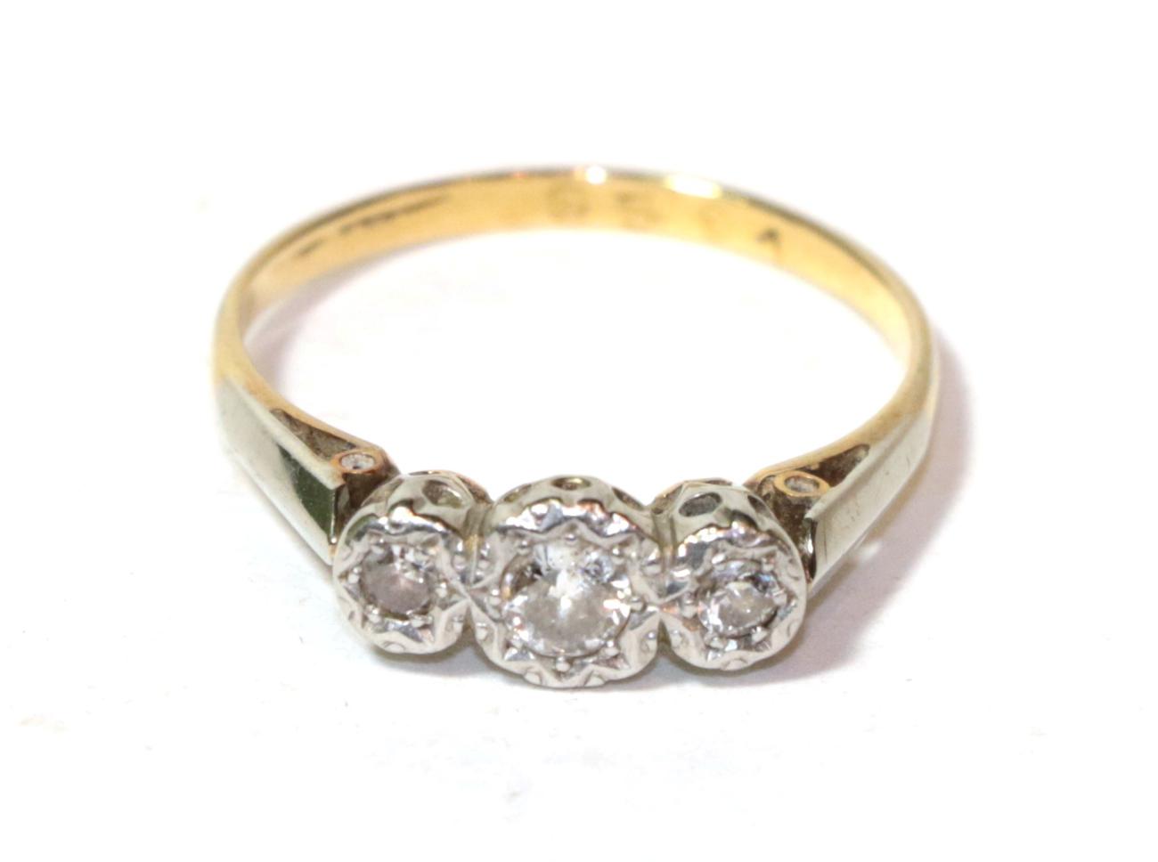 A diamond three stone ring, finger size O. Unmarked. Gross weight 2.6 grams.