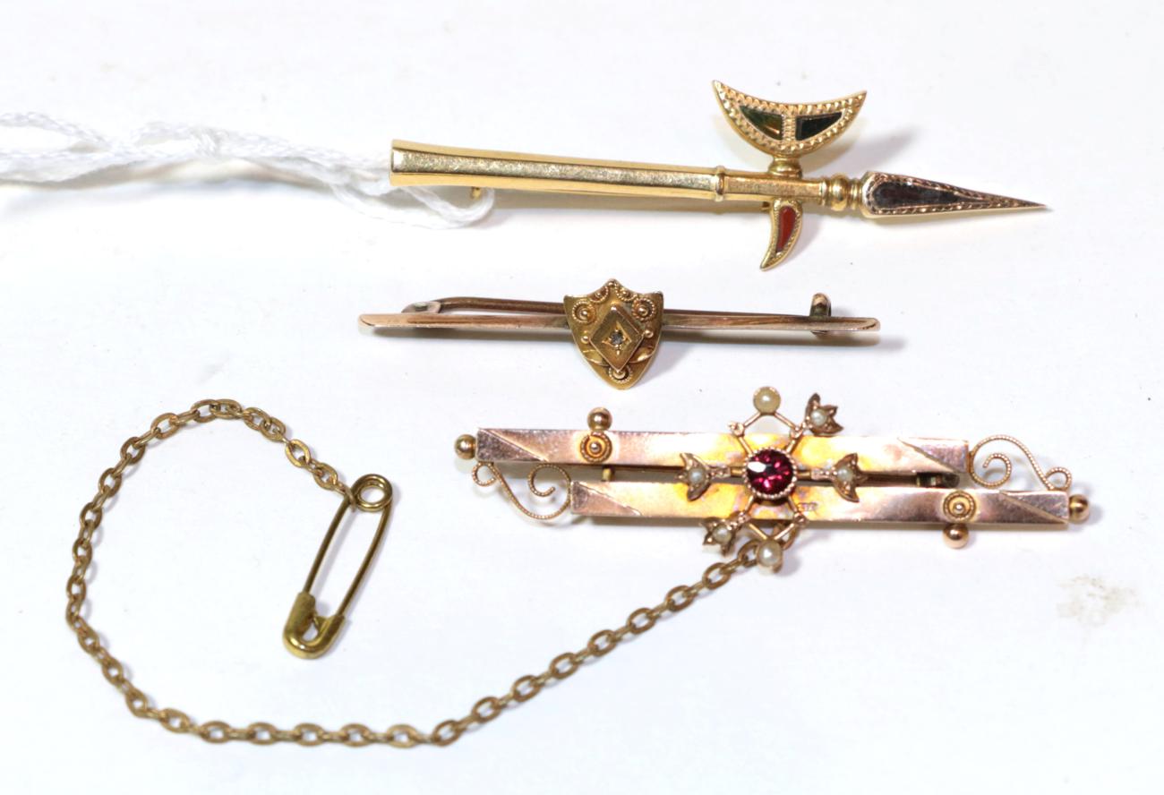 A 9 carat gold double row brooch, length 5.5cm; a bar brooch stamped '15CT', length 4.6cm; and a