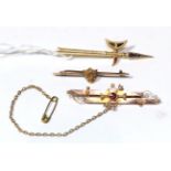 A 9 carat gold double row brooch, length 5.5cm; a bar brooch stamped '15CT', length 4.6cm; and a