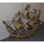 A wooden scale model of a twin-masted sailing ship