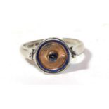 An 18 carat white gold cabochon sapphire and blue enamel ring, finger size L. Enamel damaged in