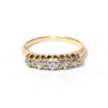 An old cut diamond five stone ring, stamped '18CT', finger size J. Gross weight 2.61 grams.