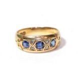 An 18 carat gold sapphire and diamond ring, finger size H. Gross weight 3.0 grams.