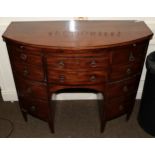 A late George III mahogany bow fronted dressing chest with brushing slide, 101cm wide