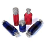 Three silver mounted blue glass scent bottles; and two silver mounted ruby glass scent bottles (5)