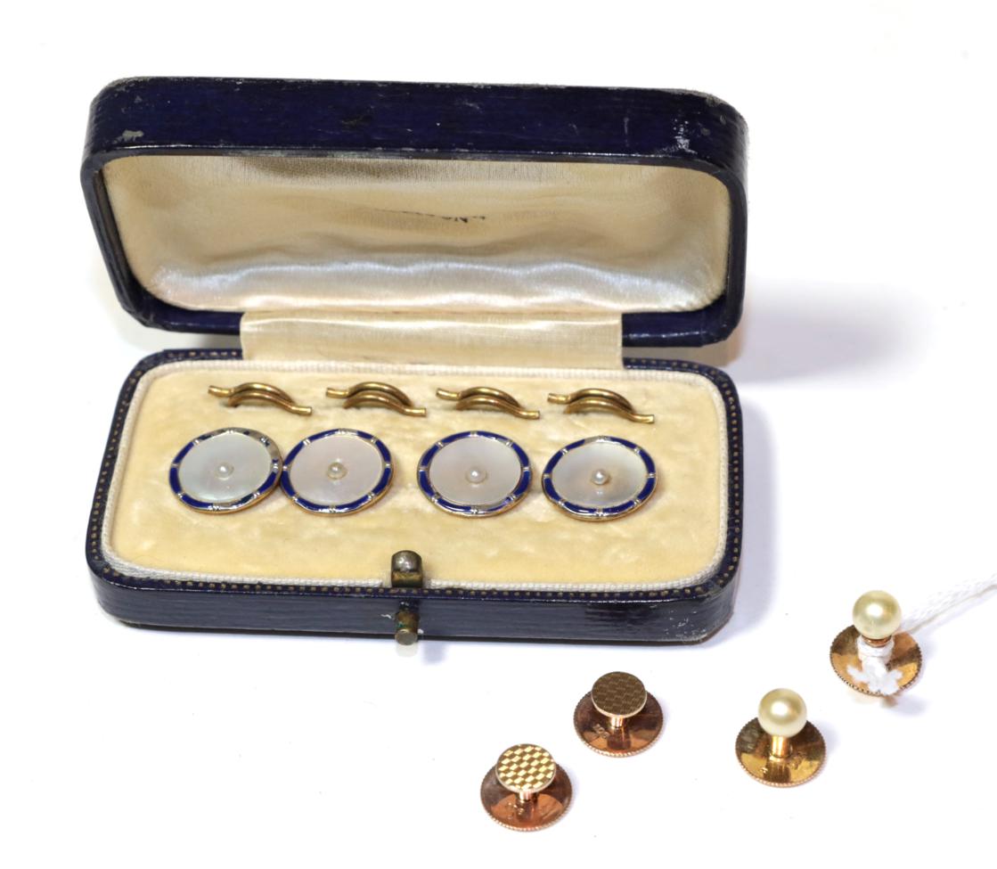 Four buttons comprised of mother of pearl, blue enamel and seed pearl (a.f.), stamped '9CT', cased