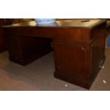 A reproduction leather top desk, 183cm wide