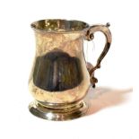 A George III silver mug, by John Payne, London, 1764, baluster and on spreading foot, with scroll