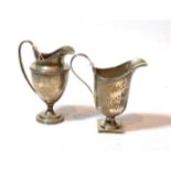 Two similar George V silver cream-jugs, both Sheffield, 1924, one by Mappin and Webb, the other by